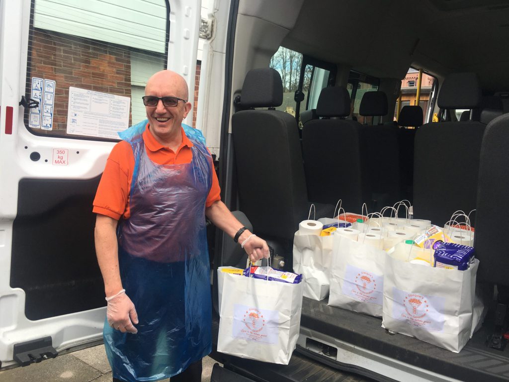 John is delivering food packs